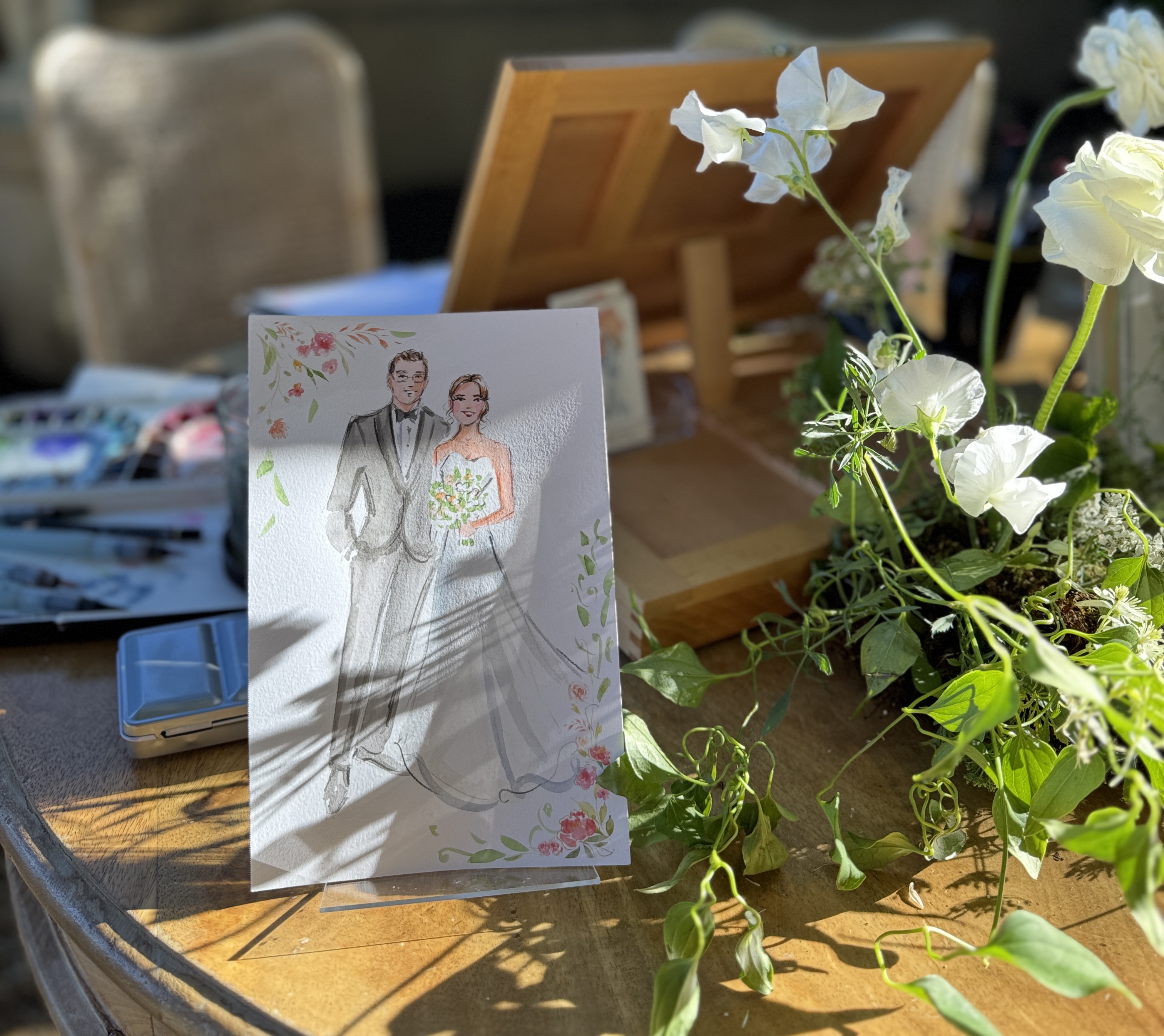 Wedding guests receiving watercolor portraits painted by Elena Fay